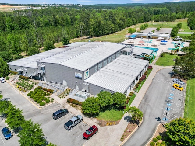 birds eye view of property with a wooded view