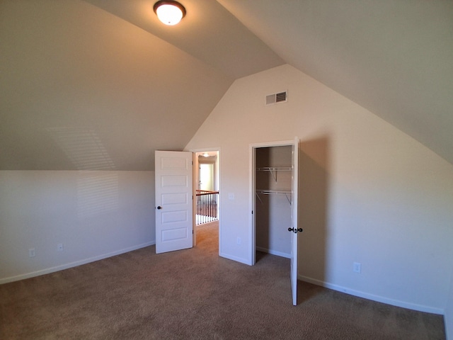 additional living space with lofted ceiling, carpet floors, visible vents, and baseboards