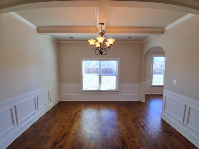 unfurnished dining area featuring a chandelier, arched walkways, dark wood-style flooring, and beamed ceiling