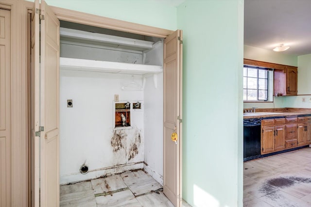 clothes washing area featuring a sink, hookup for an electric dryer, and laundry area