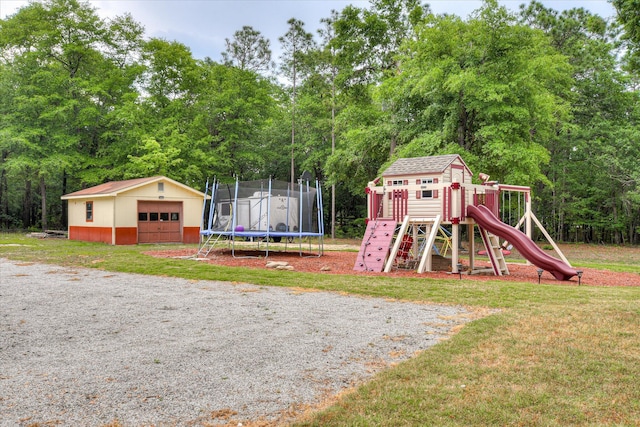 1457 Brown Rd, Hephzibah, GA 30815 - view of play area featuring a trampoline, an outdoor structure, a lawn, and view of scattered trees