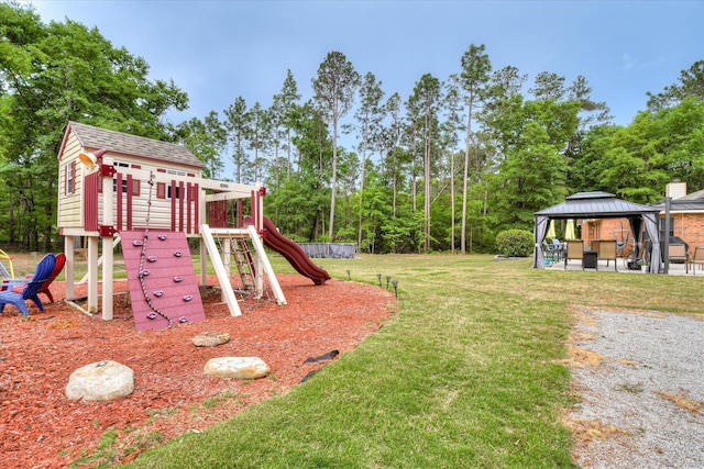 view of jungle gym with a lawn and a gazebo