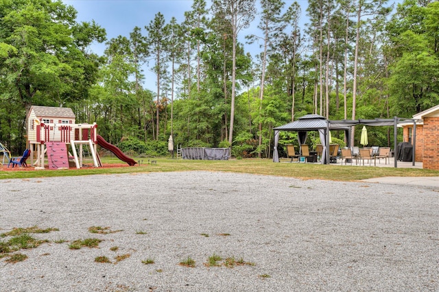 1457 Brown Rd, Hephzibah, GA 30815 - view of jungle gym with a gazebo and view of wooded area