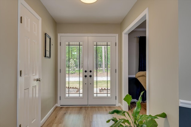 1457 Brown Rd, Hephzibah, GA 30815 - doorway with french doors, baseboards, and light wood finished floors