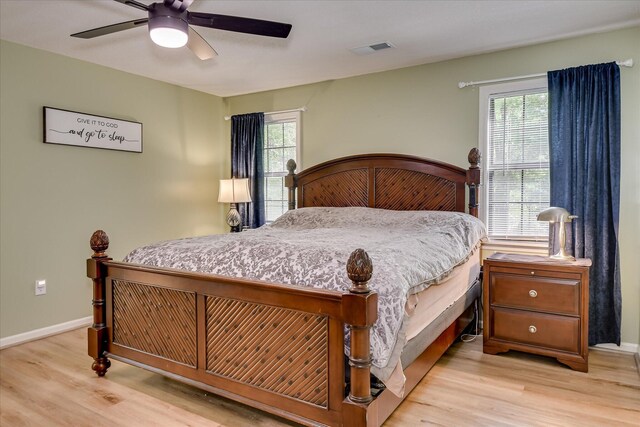 1457 Brown Rd, Hephzibah, GA 30815 - bedroom with wood finished floors, baseboards, and ceiling fan