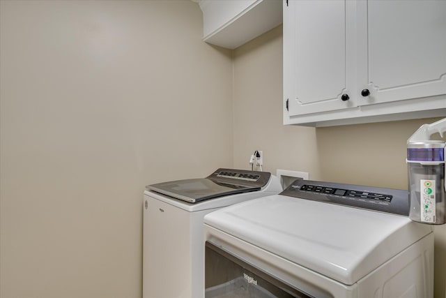 1457 Brown Rd, Hephzibah, GA 30815 - laundry area featuring washer and clothes dryer and cabinet space