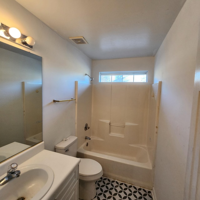 full bathroom featuring tile patterned floors, vanity, toilet, and bathing tub / shower combination