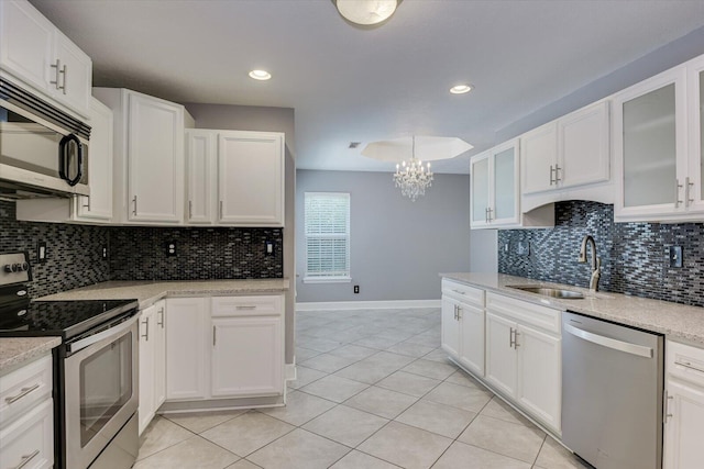 kitchen with white cabinetry and stainless steel appliances