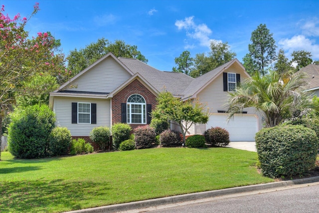 view of front of home featuring a garage and a front lawn