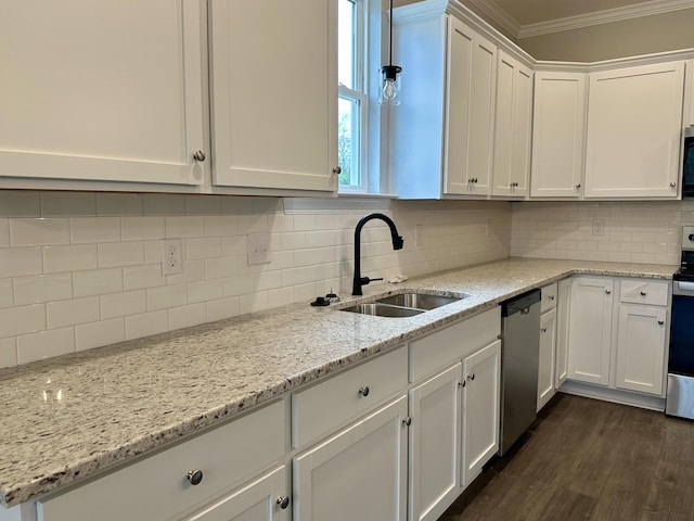 kitchen with backsplash, white cabinetry, sink, and stainless steel appliances