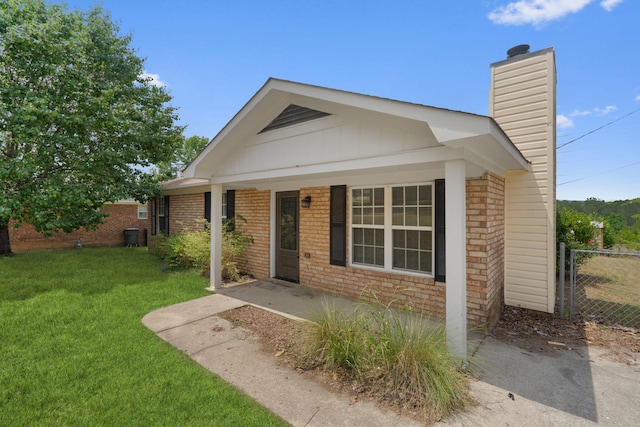 3363 Saddlebrook Dr, Hephzibah, GA 30815 - view of front facade featuring a chimney, brick siding, and a porch