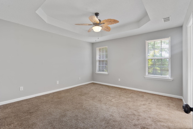 3363 Saddlebrook Dr, Hephzibah, GA 30815 - unfurnished room featuring a tray ceiling, carpet, baseboards, and ceiling fan