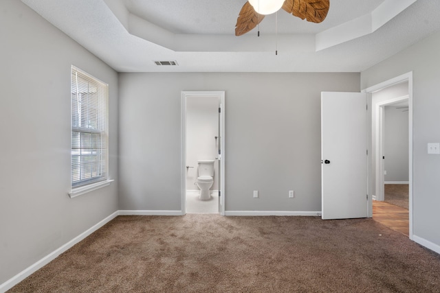 3363 Saddlebrook Dr, Hephzibah, GA 30815 - unfurnished bedroom featuring carpet flooring, a raised ceiling, baseboards, ensuite bathroom, and ceiling fan