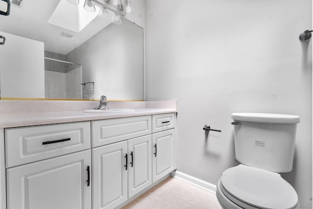 3363 Saddlebrook Dr, Hephzibah, GA 30815 - bathroom featuring toilet, vanity, baseboards, a shower, and a skylight