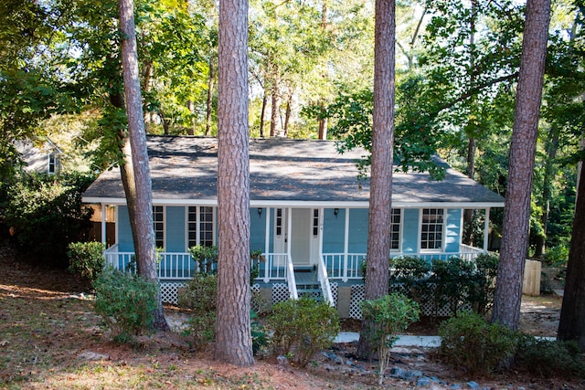 ranch-style home featuring covered porch