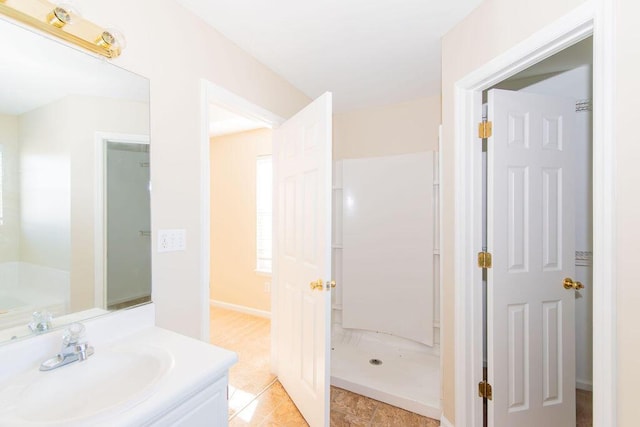 bathroom featuring vanity and walk in shower