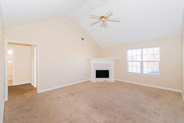 unfurnished living room featuring a fireplace, light carpet, vaulted ceiling, and ceiling fan