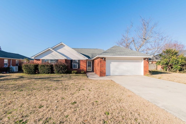 ranch-style home featuring a front yard and a garage