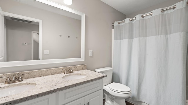 full bathroom featuring vanity, toilet, and shower / bath combo with shower curtain