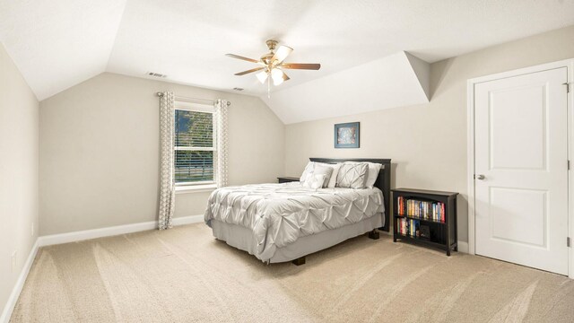 bedroom with carpet flooring, ceiling fan, and lofted ceiling