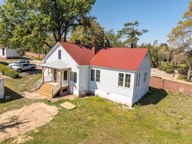 946 Milledge Rd, Augusta, GA 30904 - back of house with crawl space, a chimney, a lawn, and a metal roof