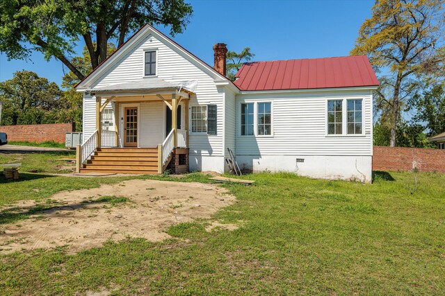 946 Milledge Rd, Augusta, GA 30904 - view of front of home featuring a porch, a front lawn, crawl space, and a metal roof