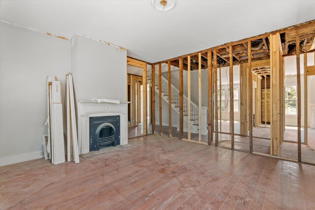 946 Milledge Rd, Augusta, GA 30904 - unfurnished living room featuring wood finished floors and a fireplace with flush hearth