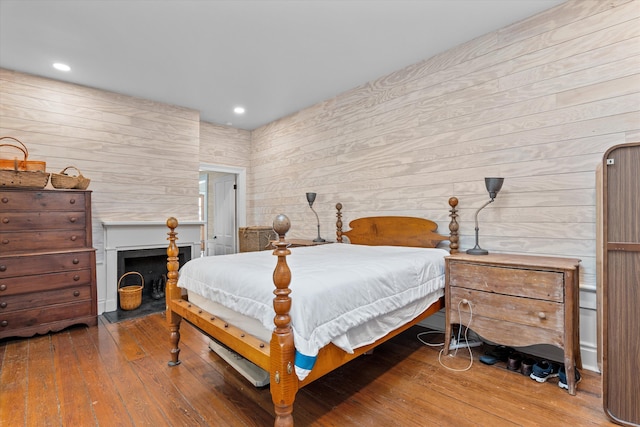 946 Milledge Rd, Augusta, GA 30904 - bedroom featuring wood-type flooring, wooden walls, and recessed lighting