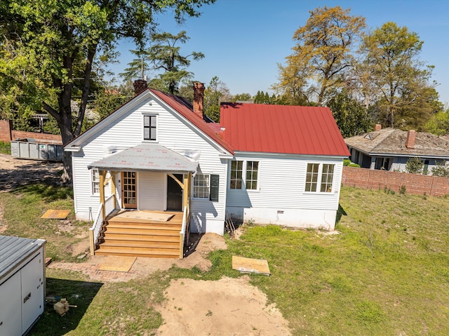 946 Milledge Rd, Augusta, GA 30904 - back of house featuring a chimney, a lawn, and a metal roof