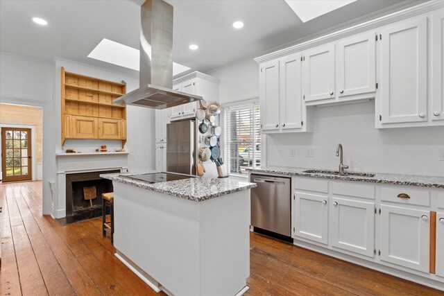946 Milledge Rd, Augusta, GA 30904 - kitchen with appliances with stainless steel finishes, island range hood, white cabinets, a kitchen island, and recessed lighting
