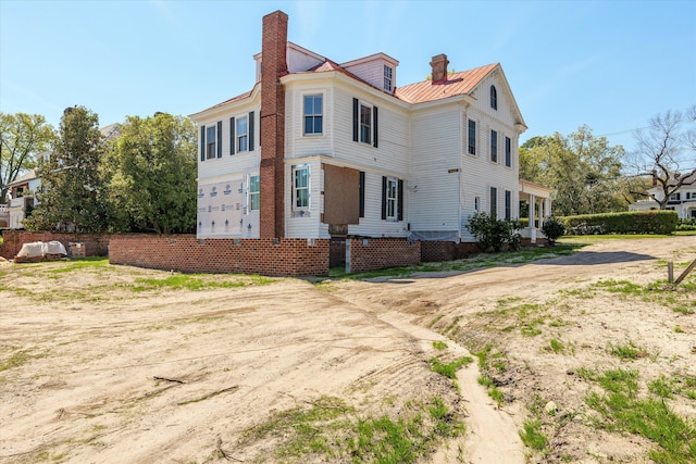 946 Milledge Rd, Augusta, GA 30904 - view of property exterior with a chimney and a metal roof