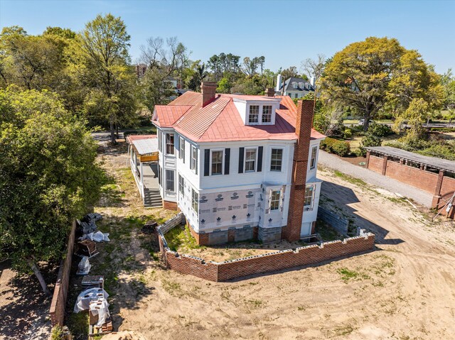 946 Milledge Rd, Augusta, GA 30904 - view of front of property featuring a chimney, dirt driveway, stairs, and view of scattered trees
