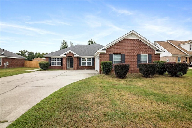 single story home featuring a front lawn