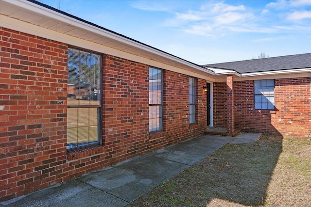 exterior space with brick siding