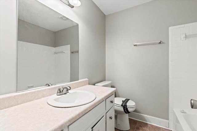 full bath with vanity, toilet, and baseboards