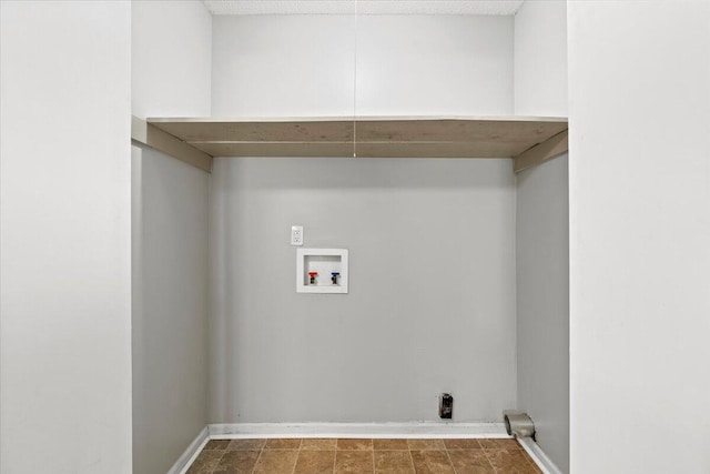 washroom featuring laundry area, hookup for a washing machine, and baseboards