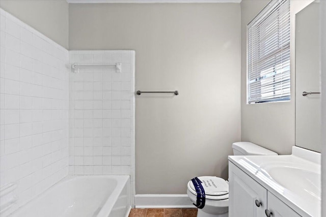 bathroom featuring vanity, tile patterned floors, and toilet