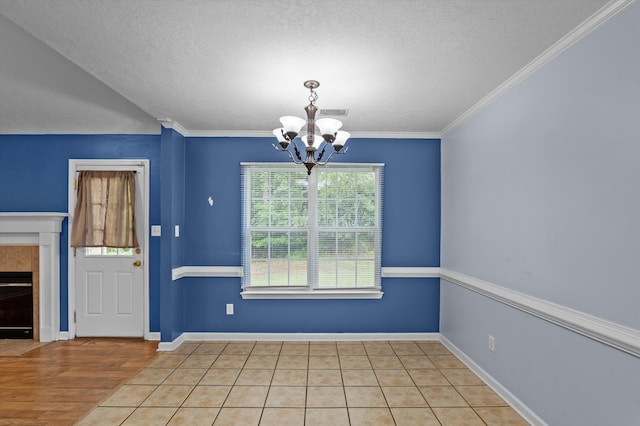 3007 Ashland Way, Grovetown, GA 30813 - unfurnished dining area featuring a chandelier, a textured ceiling, baseboards, ornamental molding, and a fireplace