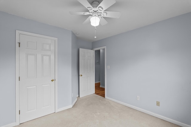 3007 Ashland Way, Grovetown, GA 30813 - unfurnished bedroom featuring baseboards, carpet floors, and a ceiling fan