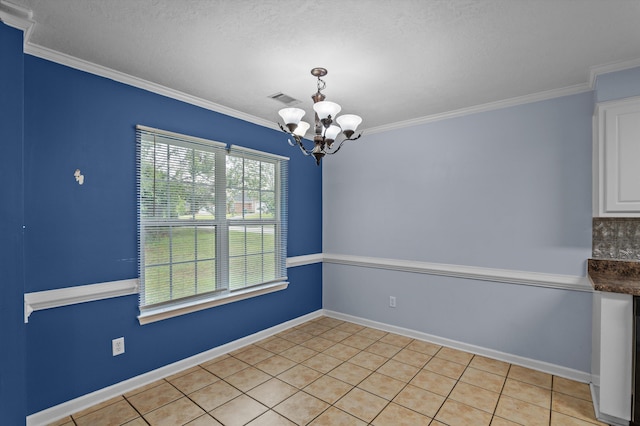 3007 Ashland Way, Grovetown, GA 30813 - unfurnished dining area featuring a chandelier, crown molding, light tile patterned flooring, baseboards, and a textured ceiling