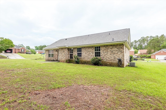 3007 Ashland Way, Grovetown, GA 30813 - rear view of house with a lawn, brick siding, a shingled roof, and central AC