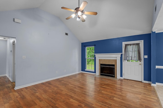 3007 Ashland Way, Grovetown, GA 30813 - unfurnished living room with a ceiling fan, wood finished floors, a tile fireplace, high vaulted ceiling, and baseboards