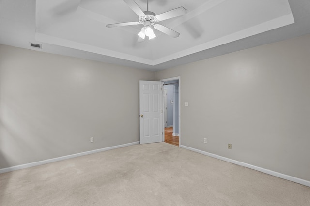 3007 Ashland Way, Grovetown, GA 30813 - unfurnished bedroom featuring a tray ceiling, light carpet, baseboards, and ceiling fan