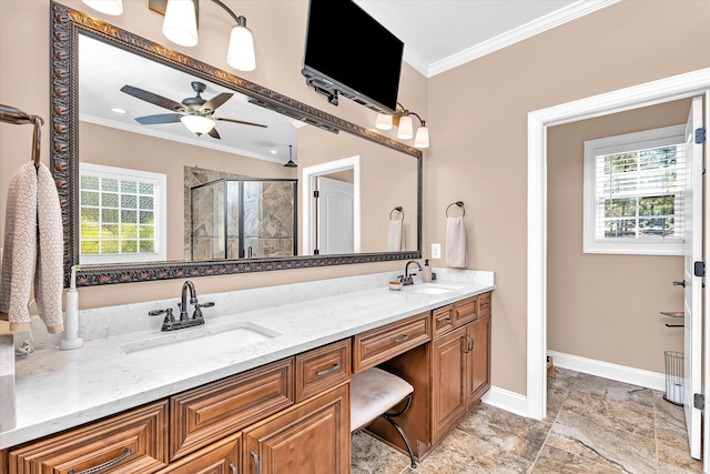 bathroom featuring vanity, a shower with door, ornamental molding, and ceiling fan