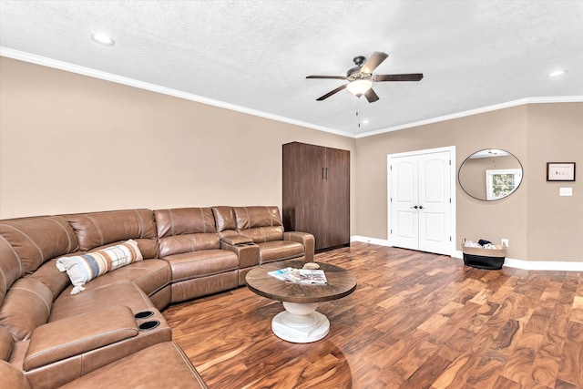 unfurnished living room featuring ceiling fan, crown molding, wood-type flooring, and a textured ceiling