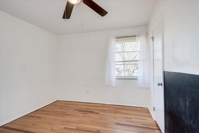 unfurnished room featuring ceiling fan and light wood-type flooring