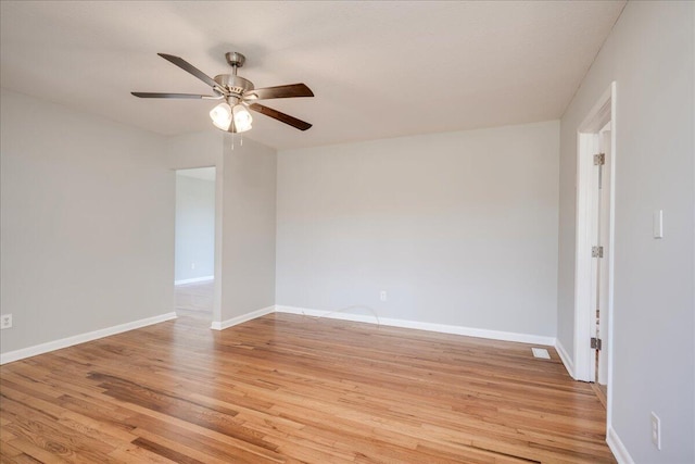 spare room featuring light wood-type flooring and ceiling fan