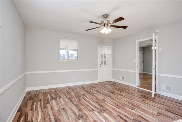 unfurnished room featuring wood-type flooring and ceiling fan