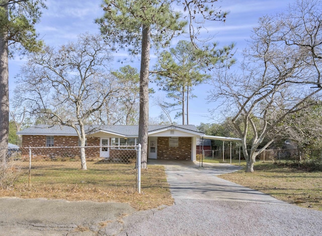 single story home featuring a carport