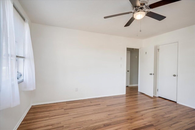 unfurnished bedroom featuring ceiling fan and light wood-type flooring